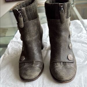 Chanel Women’s Gray Distressed Suede Leather Ankle Boots with CC Logo Buttons.